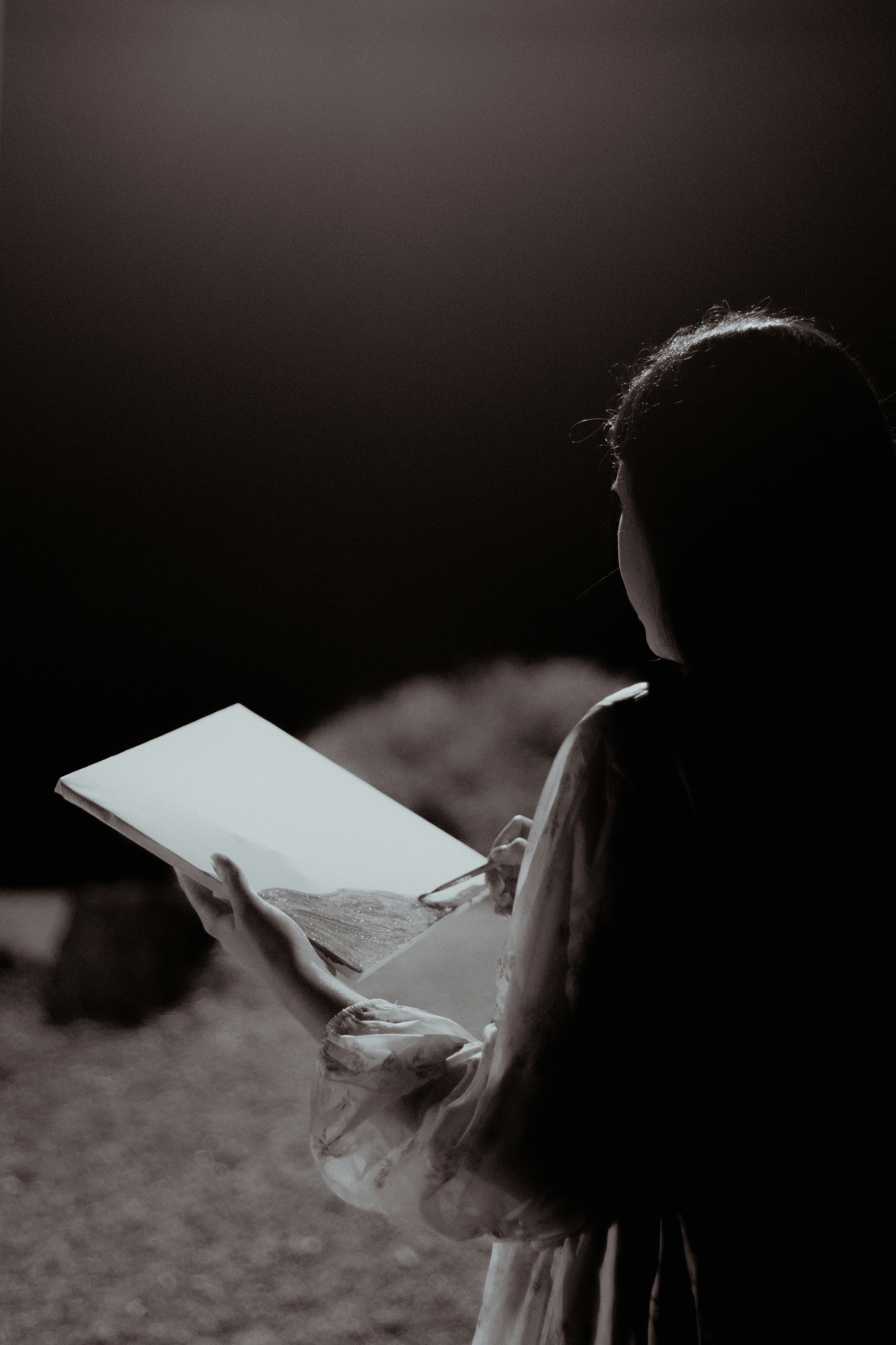 A woman holding a book in her hands