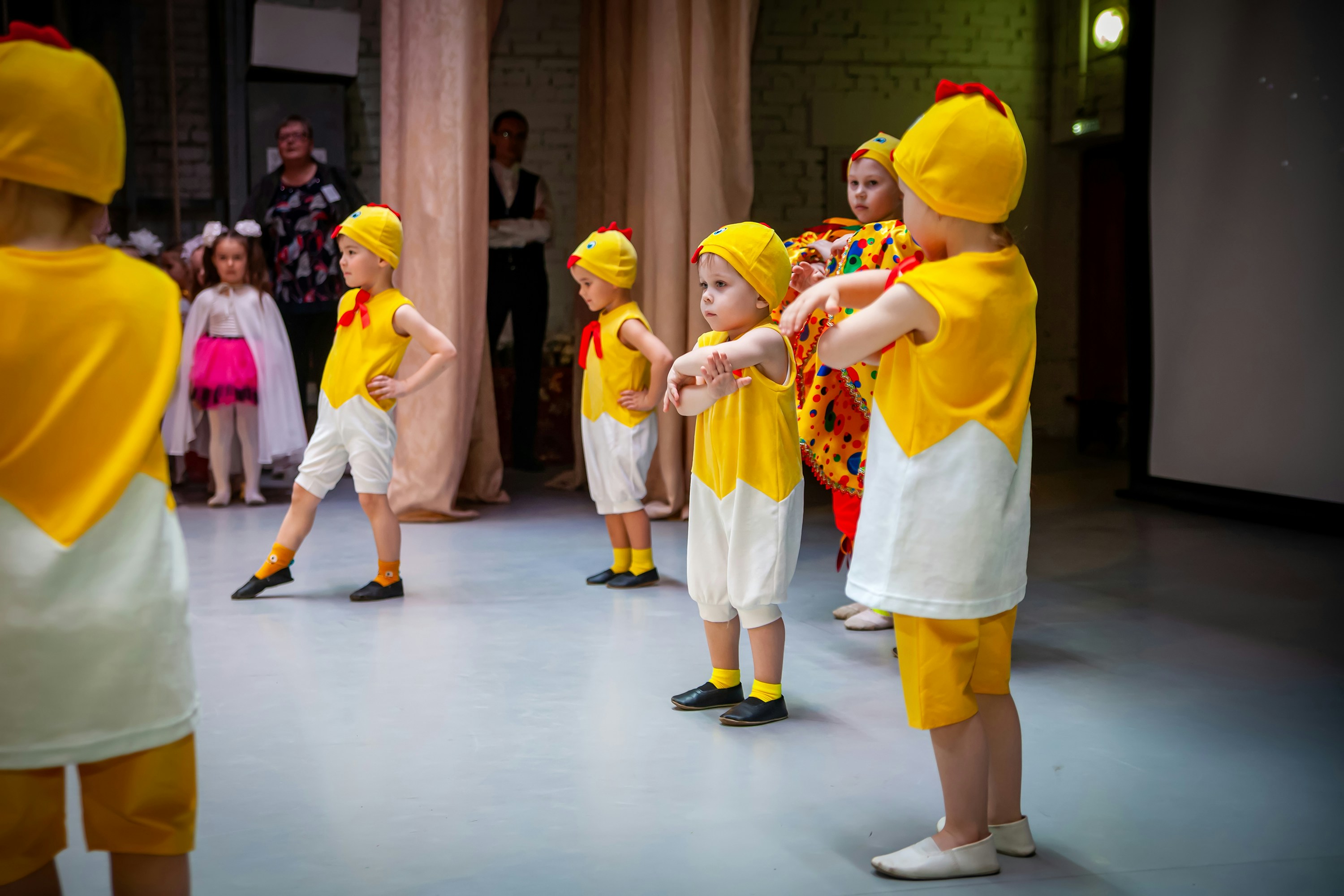 a group of children in yellow shirts