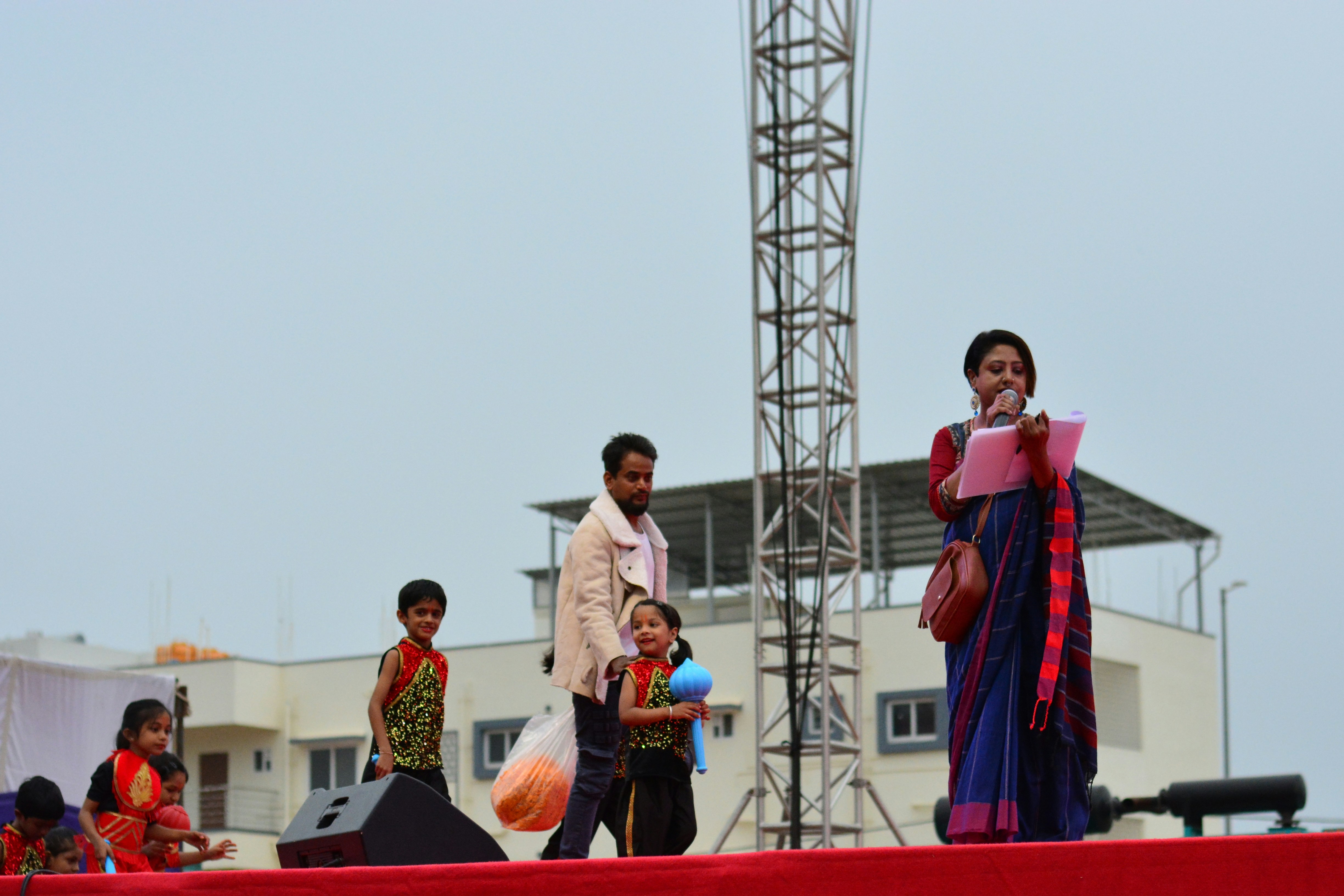 A group of people standing on top of a stage