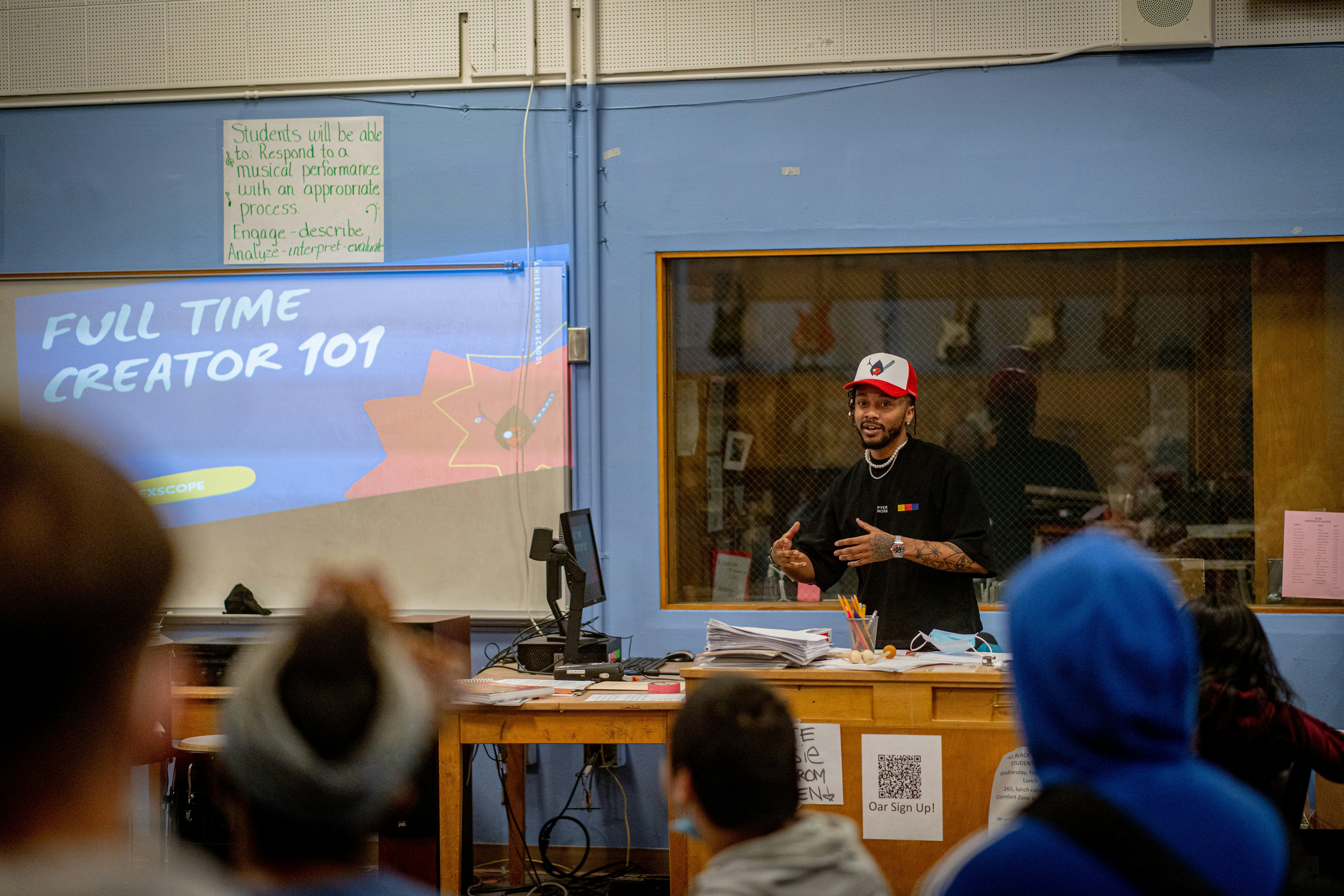 Lexscpoe teaching a class by School Play Scripts a person giving a presentation