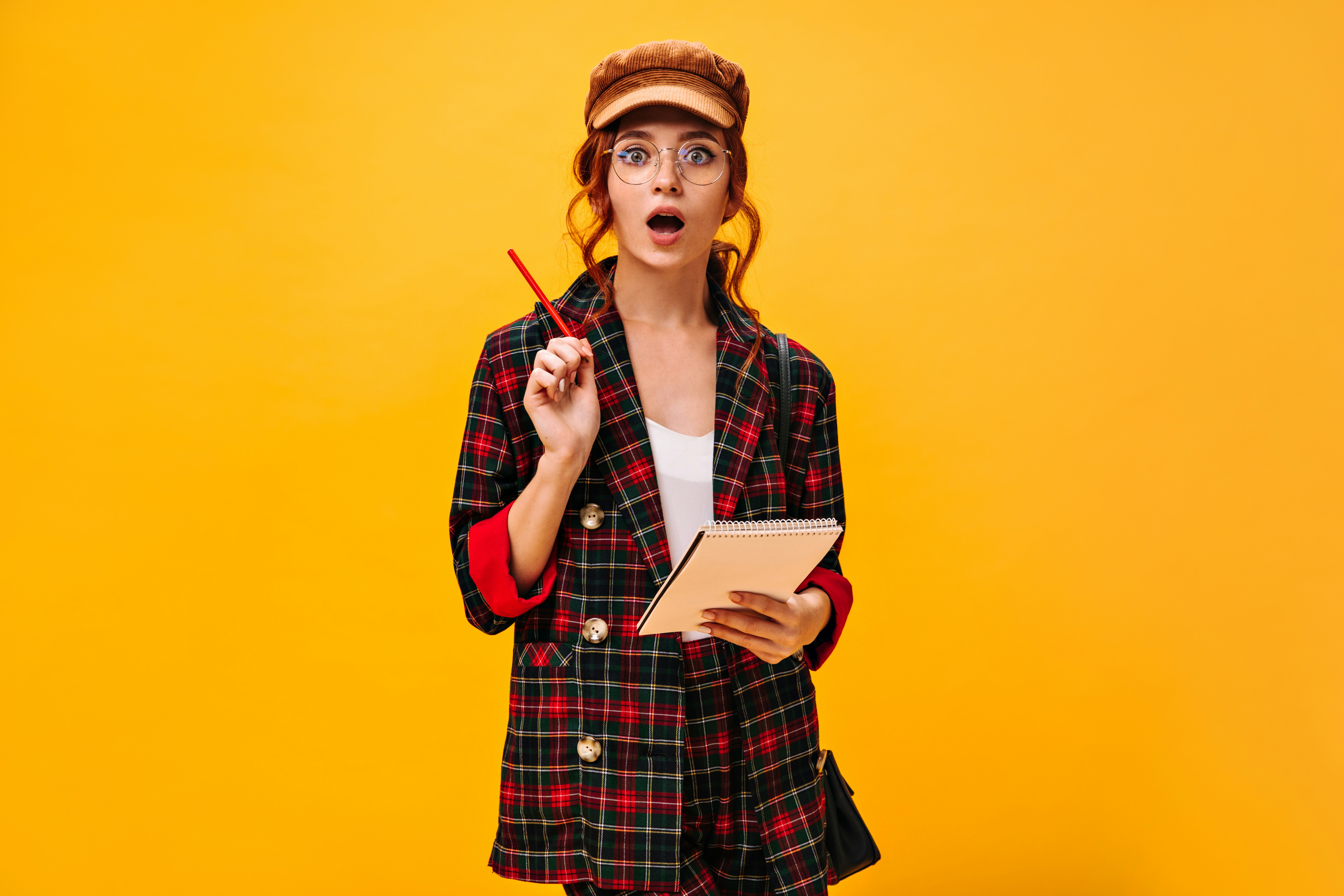 🤔 Frequently Asked Questions (FAQ) About Downloading Play Scripts by School Play Scripts a woman in a plaid jacket holding a pen and notebook