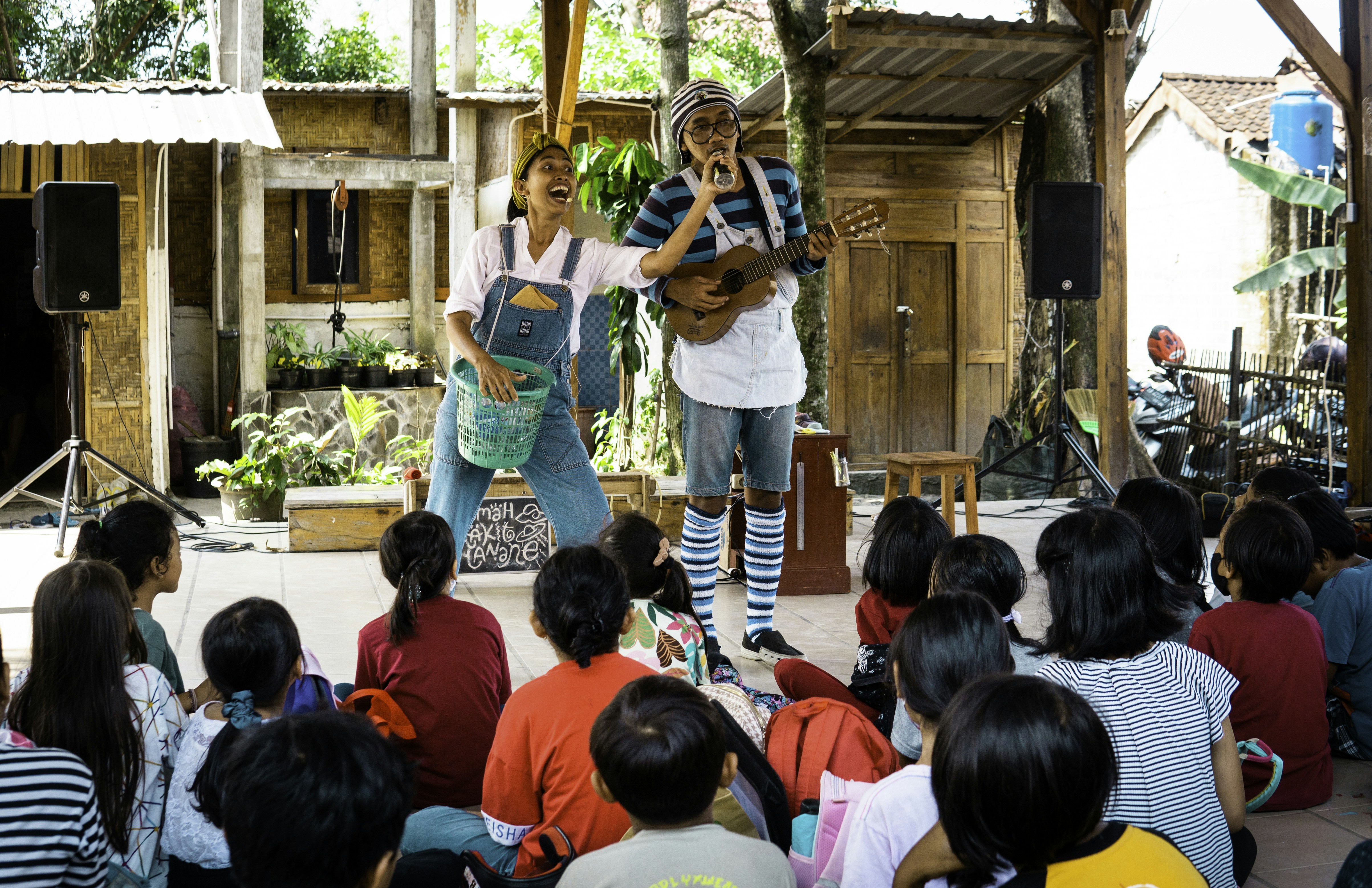 Show Time by School Play Scripts Performers entertain children with music and laughter.