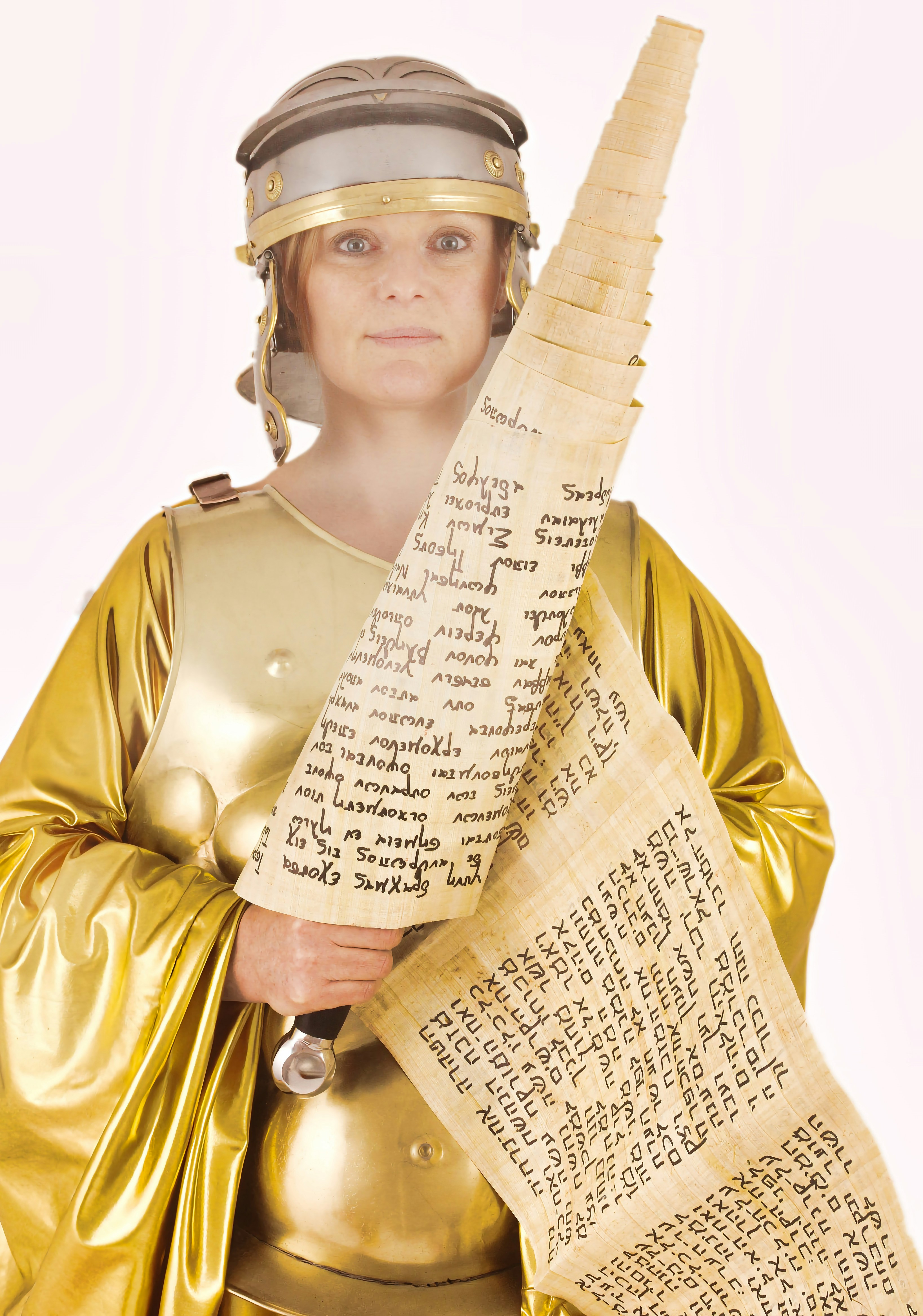 A woman in a golden dress and a sword by School Play Scripts A statue of a woman holding a large piece of paper