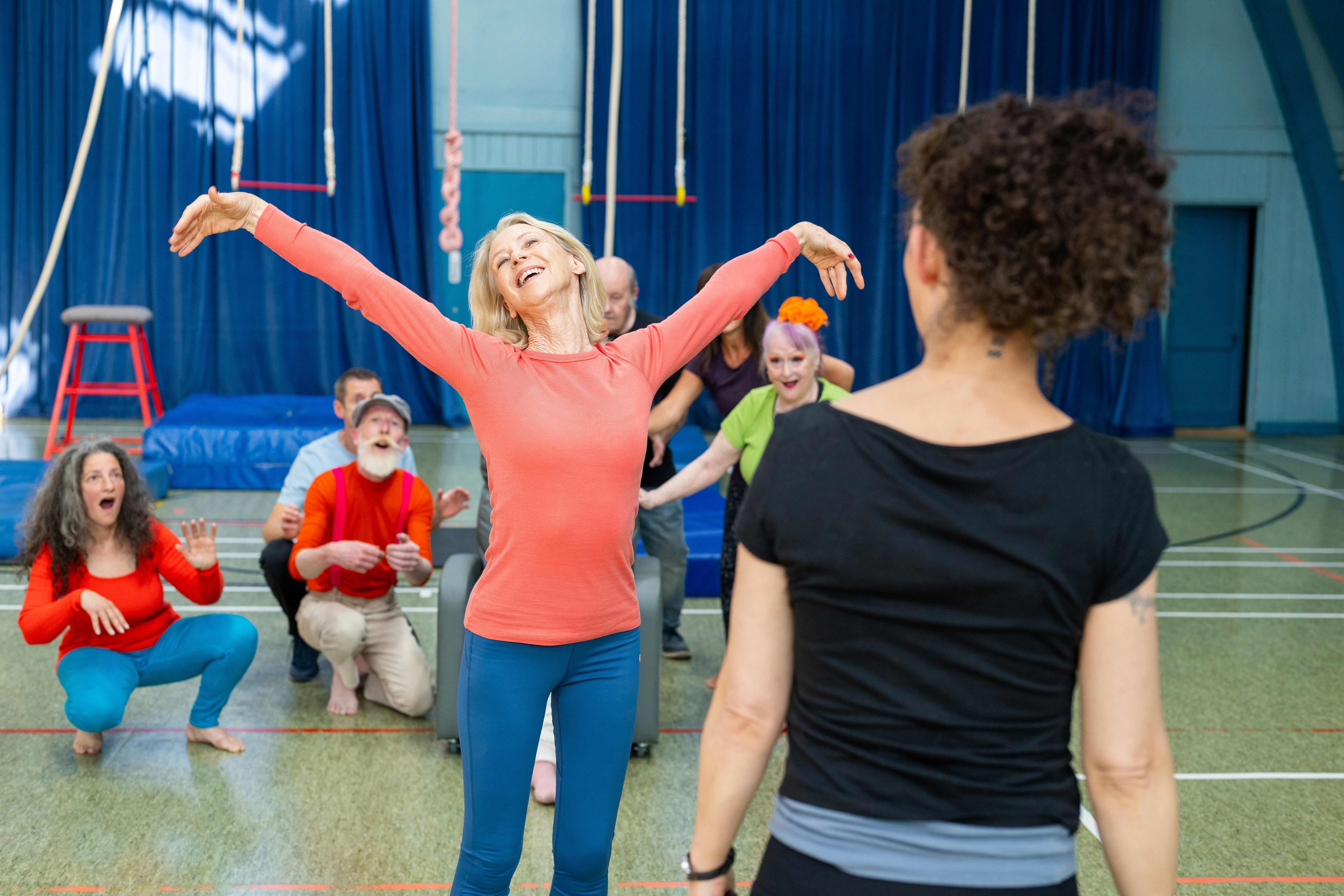 ❓ FAQ: Your Burning Questions About Multicultural School Play Scripts Answered by School Play Scripts People practicing circus arts in a gymnasium.
