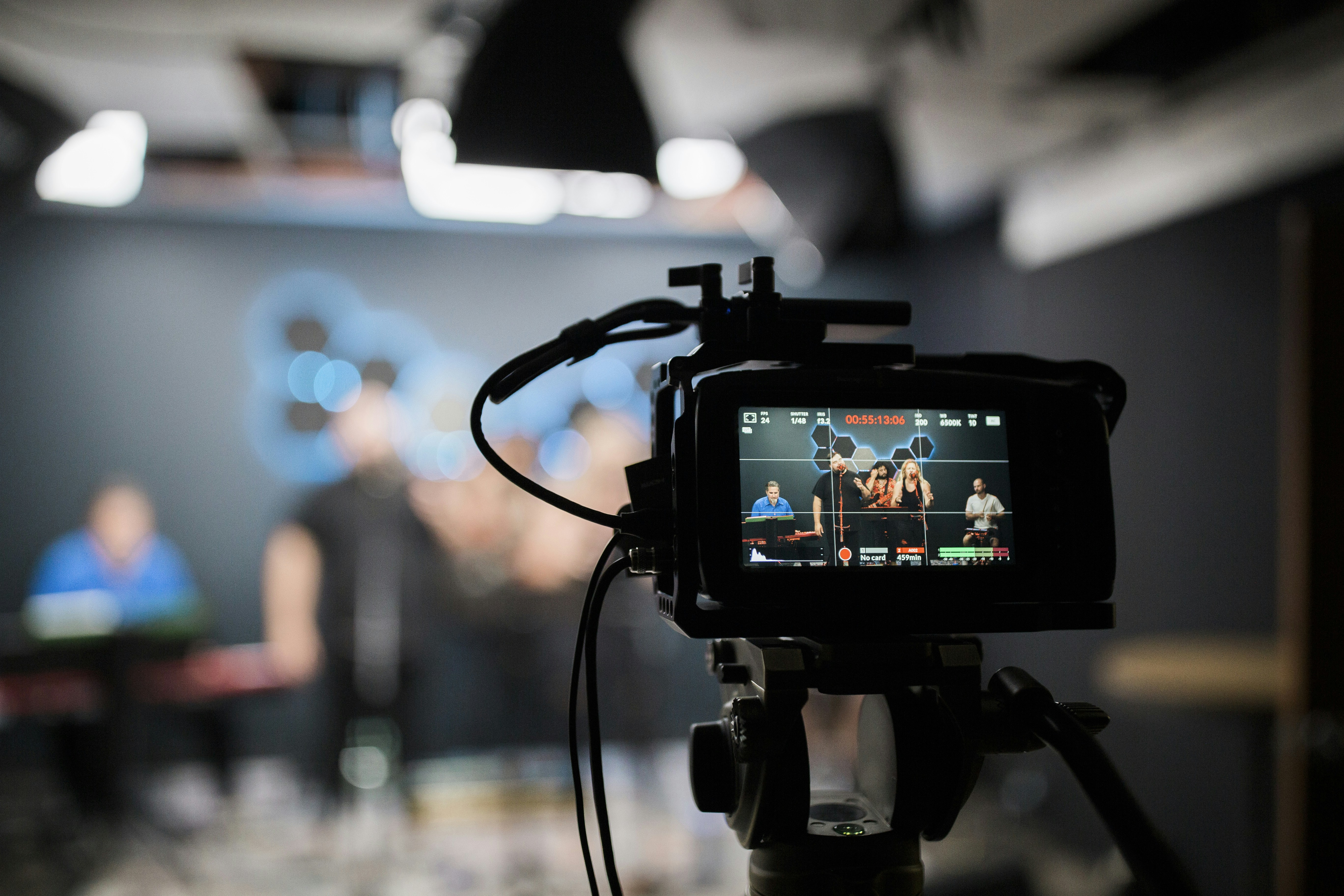Filming worship for livestream at Bethel Church in Austin, TX. by School Play Scripts A professional video camera recording a musical group performing in a studio