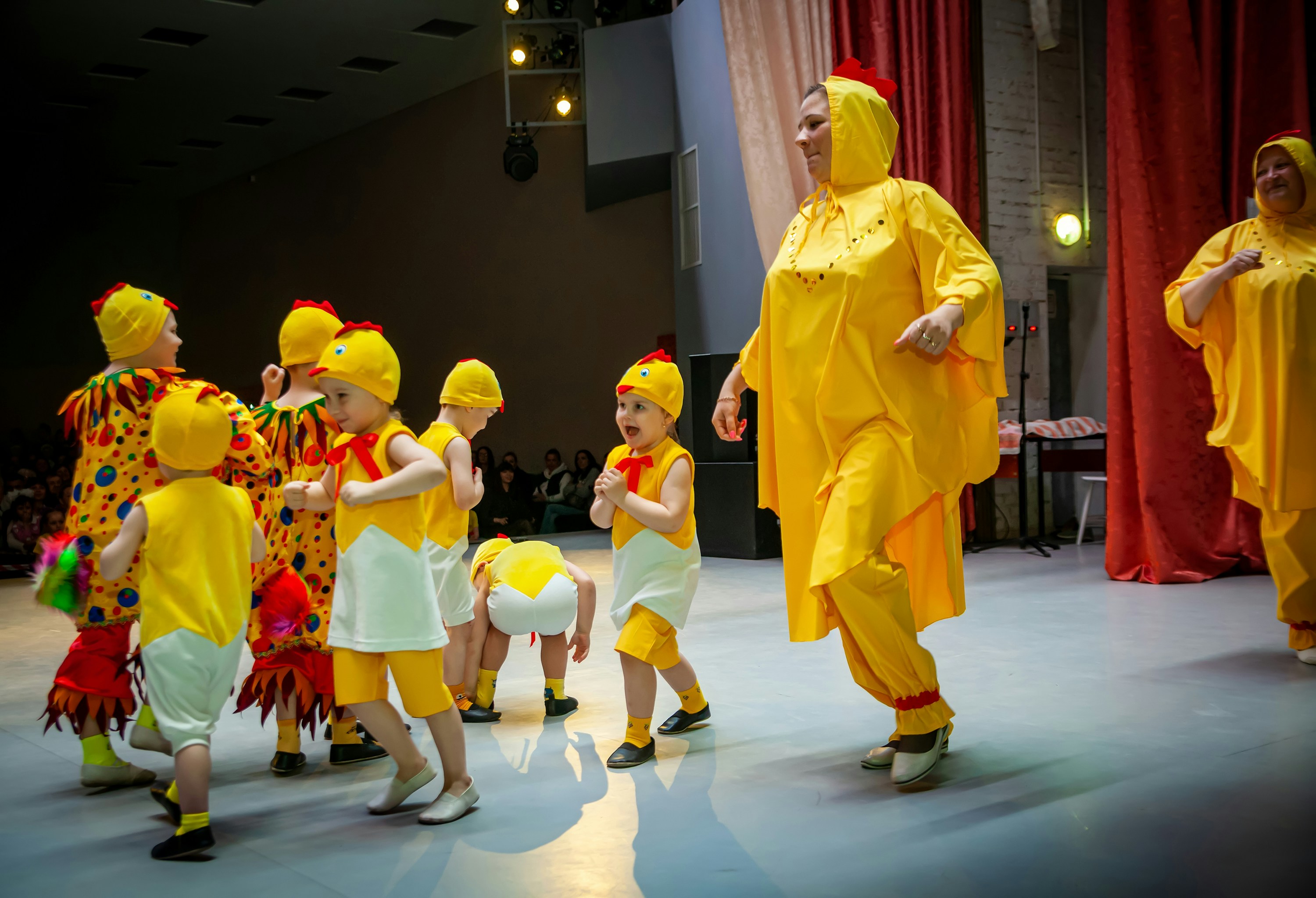 ❓ FAQ by School Play Scripts a person in a garment surrounded by children