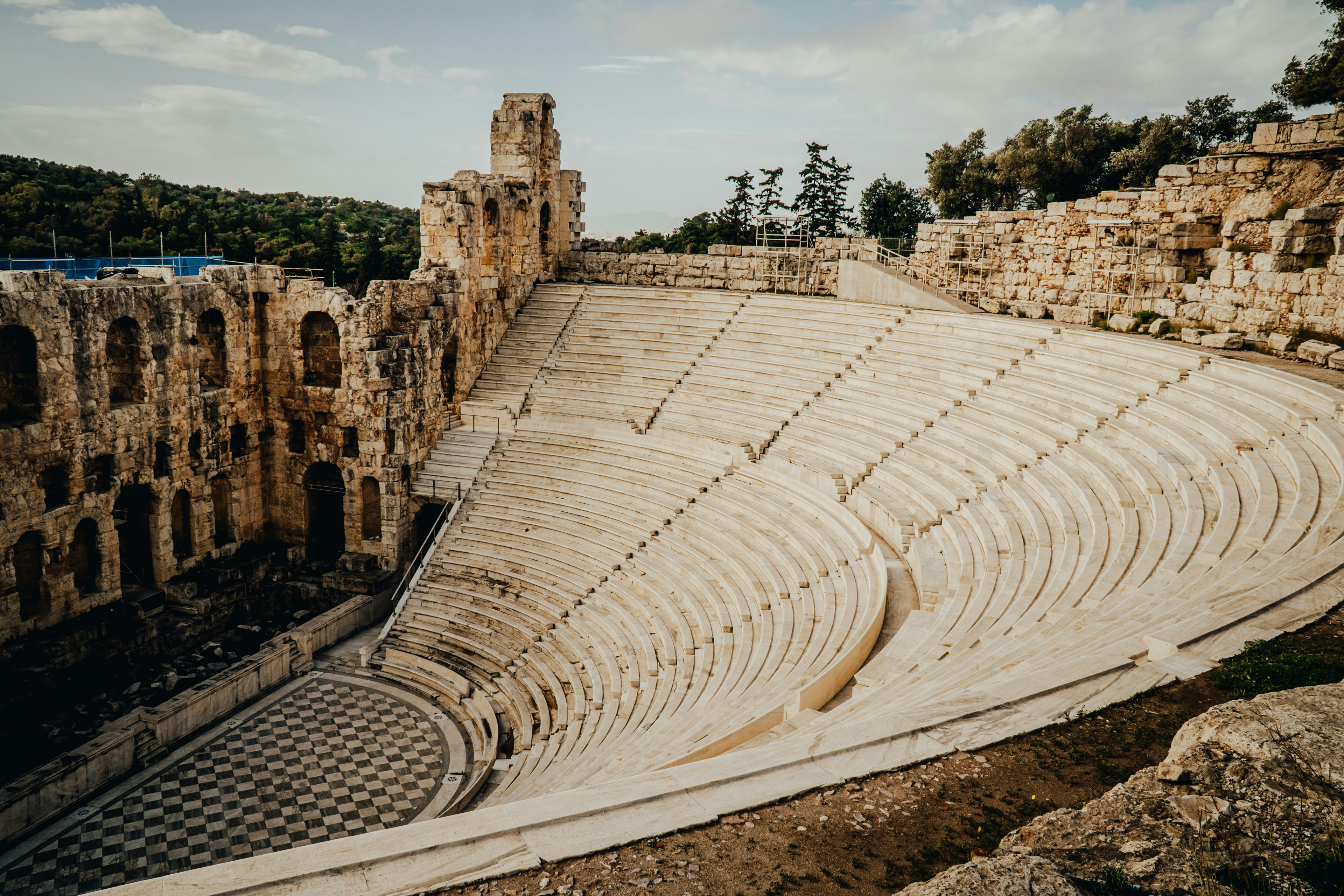 🏛️ From Ancient Amphitheaters to Modern Stages: A Brief History of Play Scripts by School Play Scripts a large stone amphit with a few people inside of it