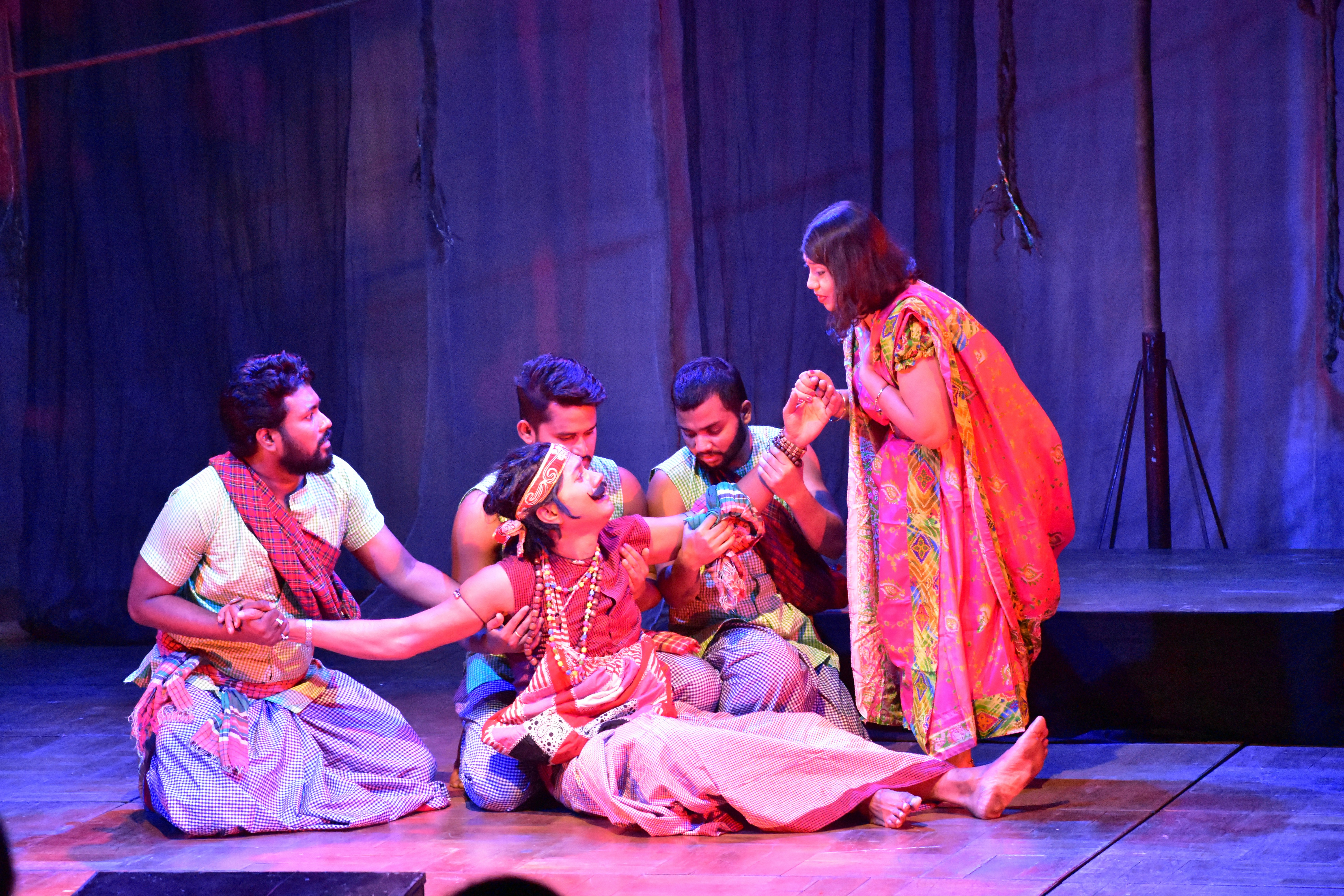 Emotive theatrical production at Shilapakala Academy captures the audience's attention, offering an intimate and powerful exploration of human emotions. by School Play Scripts Actors perform a dramatic scene on a stage.