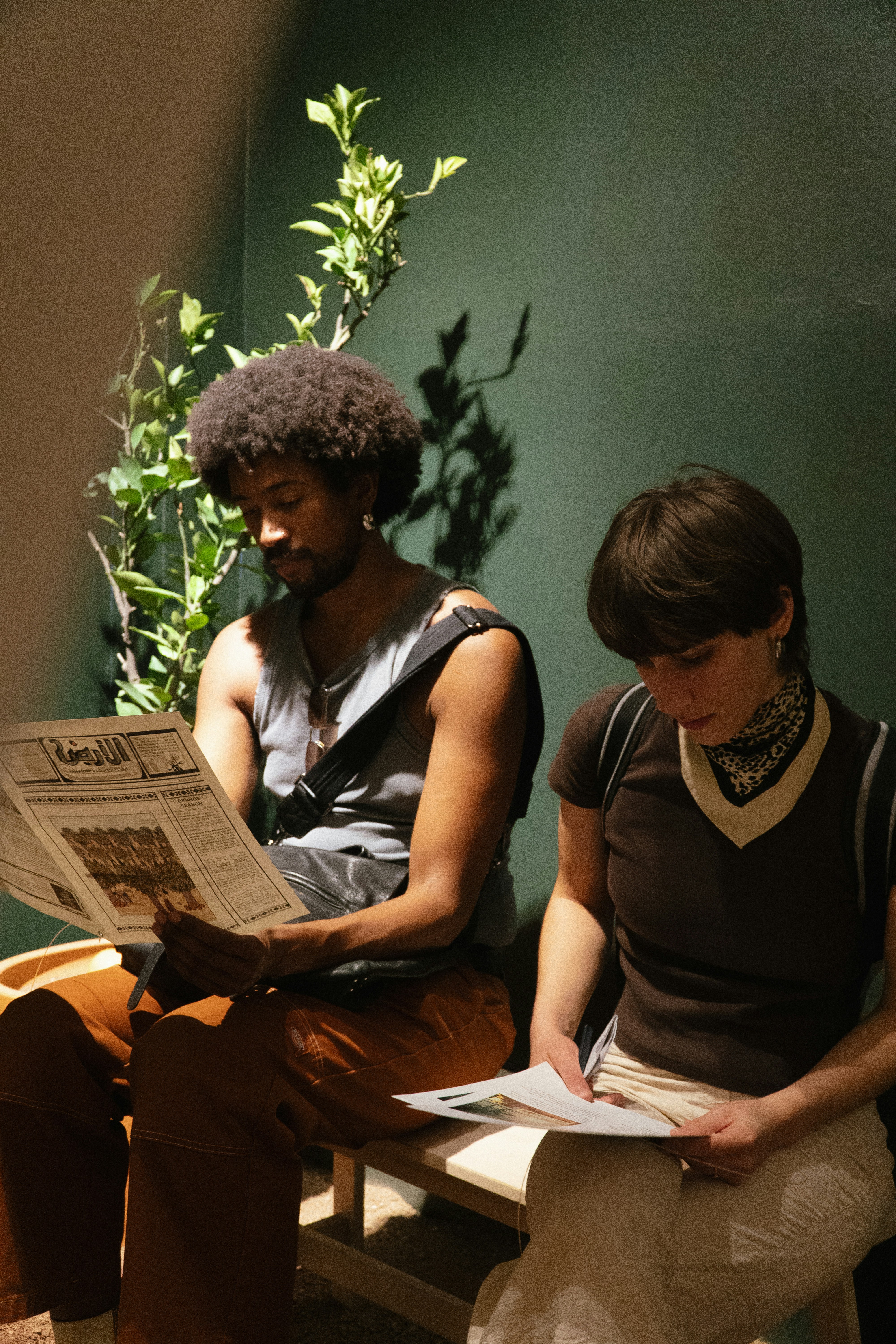📜 From the Bard to the Black Box: A Brief History of School Play Rehearsal Techniques by School Play Scripts Two people sitting and reading newspapers
