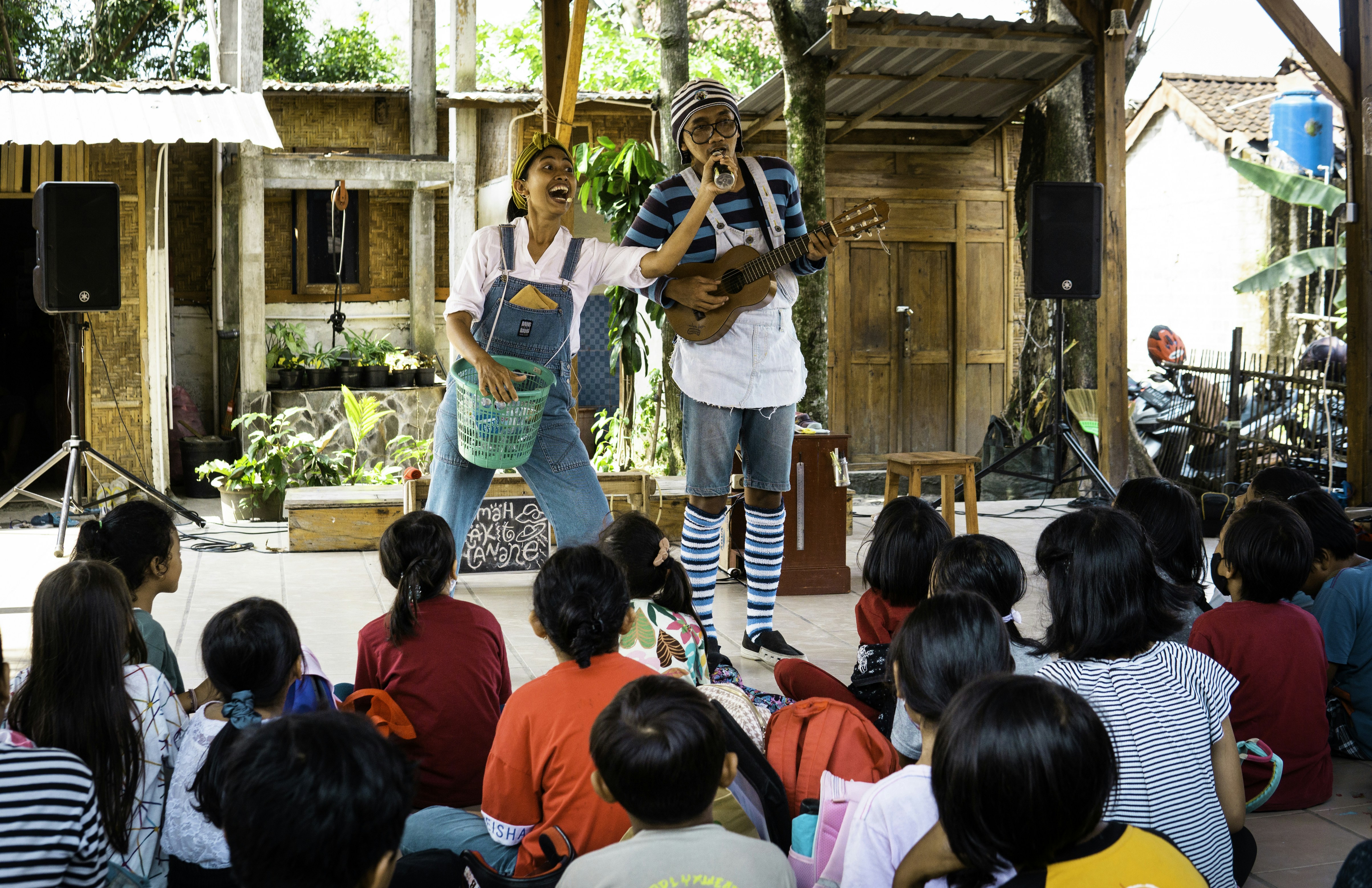 Show Time by School Play Scripts Performers entertain children with music and laughter.