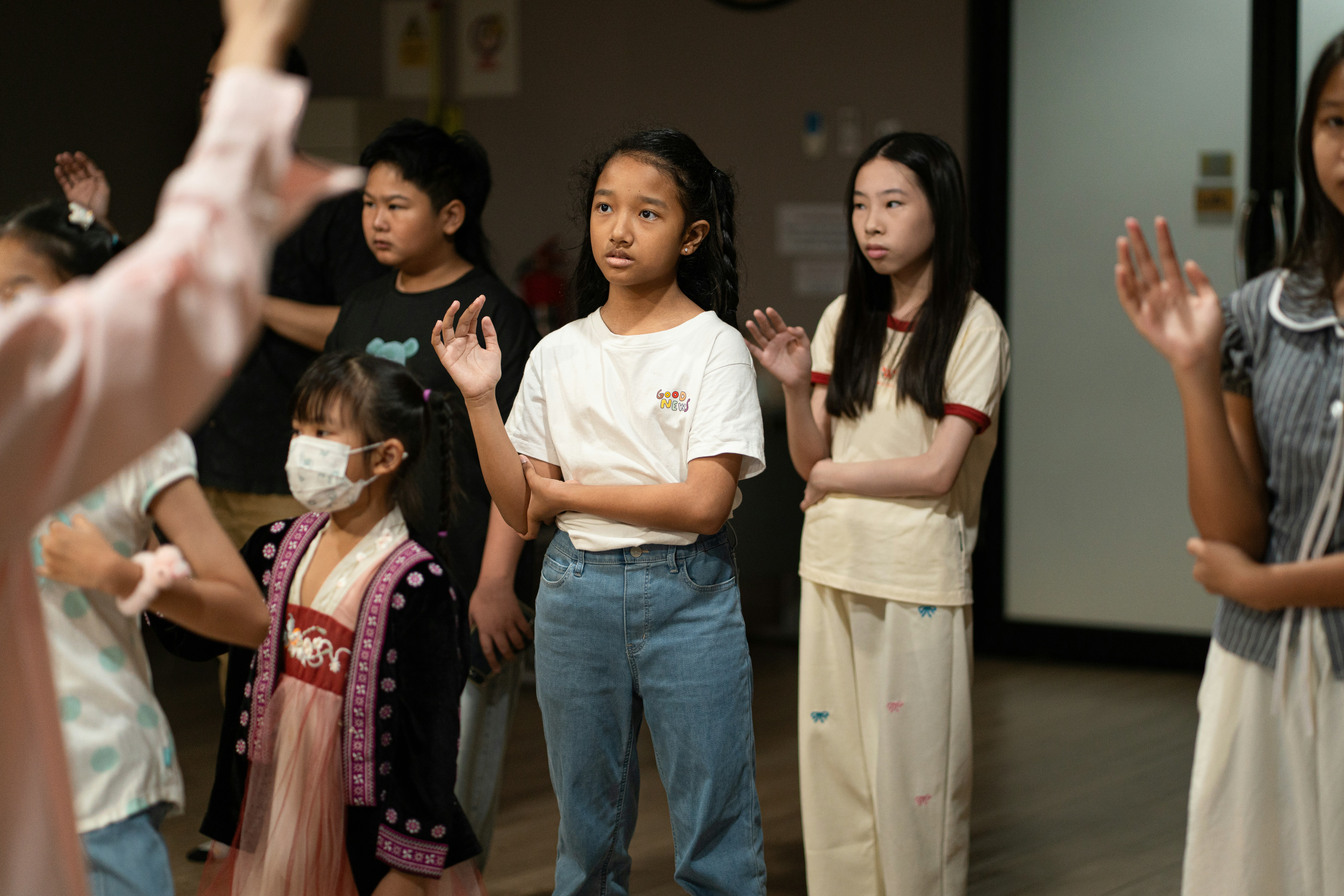Reader's theatre scripts for schools by School Play Scripts A group of children raising their hands in a classroom setting