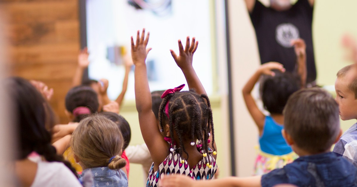 children lifting hands